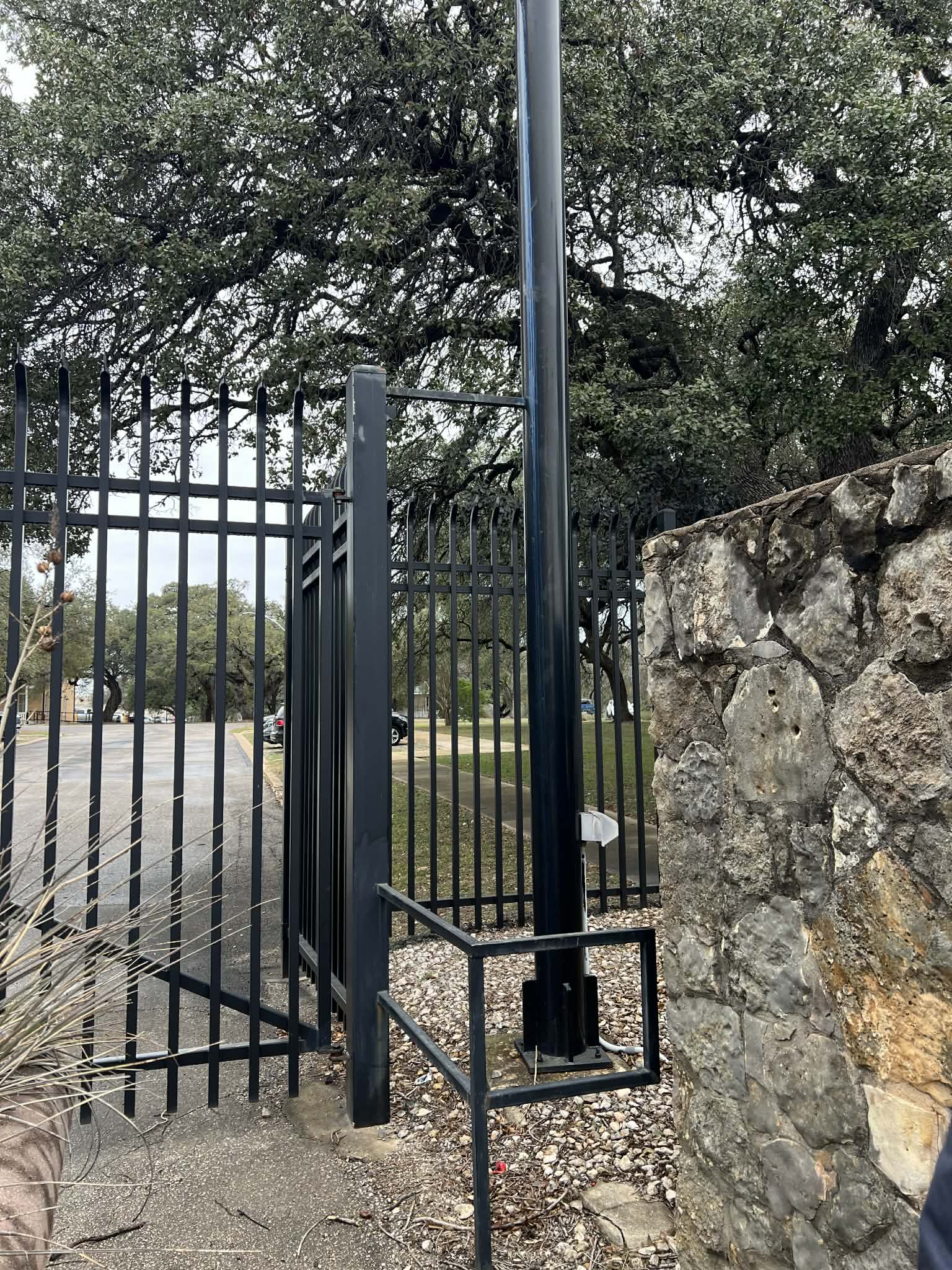 Iron Gate with Stone Pillars